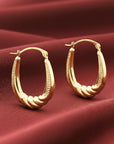 10K Yellow Gold Oval Diamond-Cut Twist Hoop Earrings