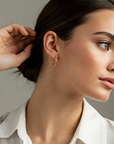 14k Yellow Gold X Pattern Diamond-Cut Oval Hoop Earrings