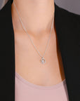 CZ Dangling Halo Heart Charm Necklace in Sterling Silver