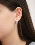 CZ Infinity Huggie Hoop Earrings in Sterling Silver