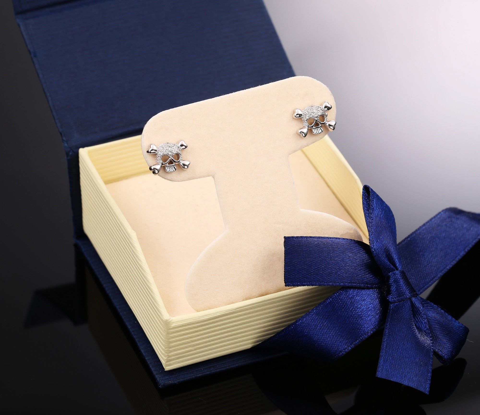 CZ Small Skull and Bones Stud Earrings in Sterling Silver