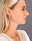 14K Gold Two-Tone Twisted Hoop Earrings With Engraved Diamond-Cuts