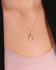 Love Knot Charm Necklace in Sterling Silver