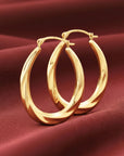10K Yellow Gold Oval Spiral Twist Hoop Earrings