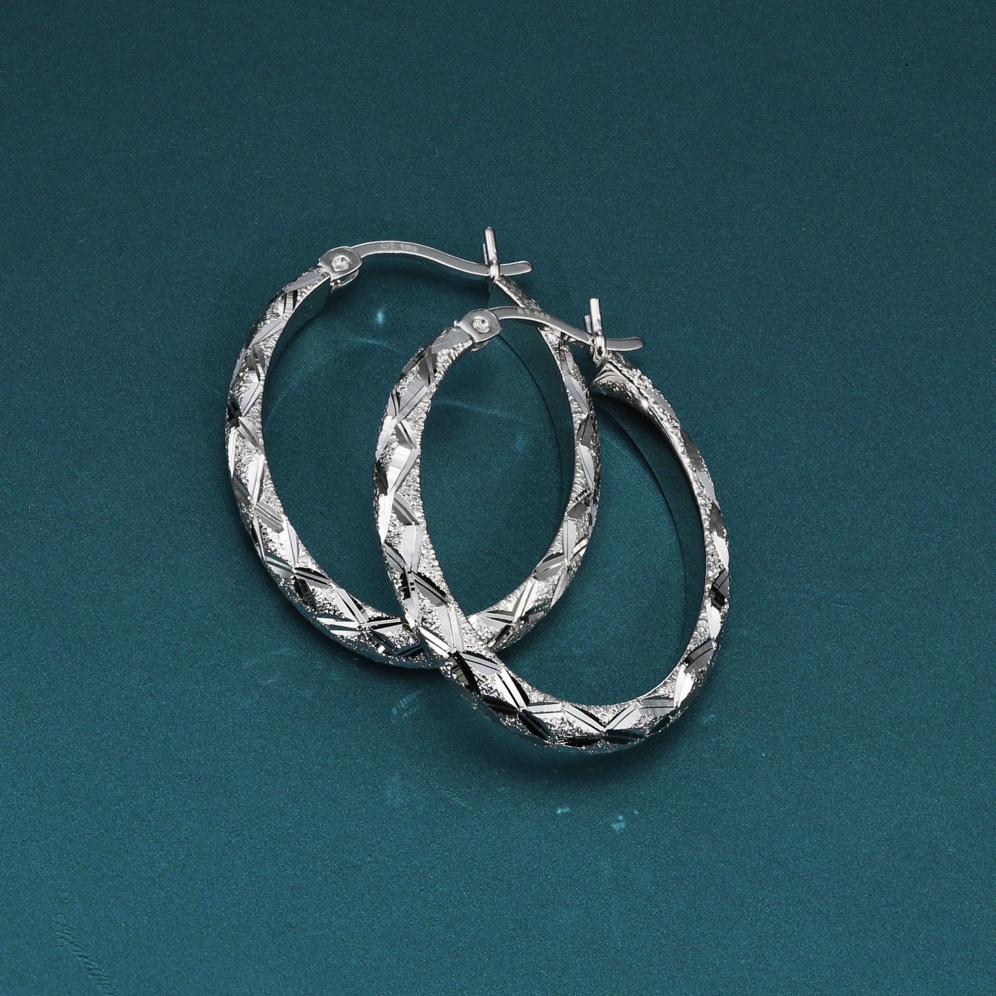 Brilliant X-pattern Round Tubular Hoop Earrings in Sterling Silver