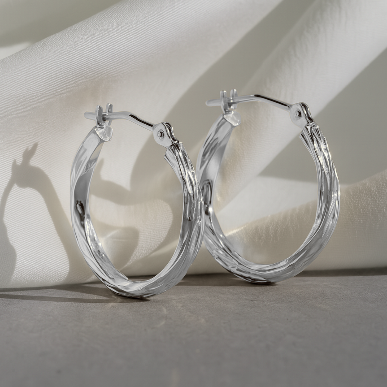 10K White Gold Twisted Diamond-Cut Hoop Earrings
