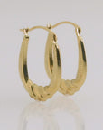 10K Yellow Gold Oval Diamond-Cut Twist Hoop Earrings